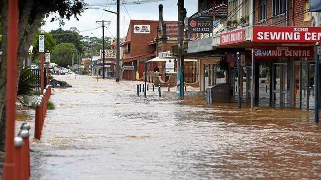 Heavy flood water tearing through the Lismore CBD in April this year. Picture: Marc Stapelberg