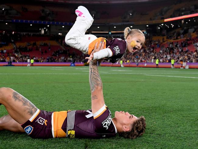 Reece Walsh of the Broncos celebrates with his daughter Leila after winning the NRL Preliminary Final match between the Brisbane Broncos and New Zealand Warriors. Picture: Bradley Kanaris/Getty Images