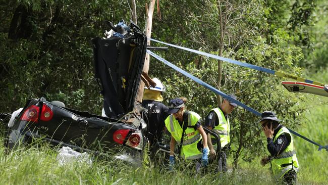 The scene on Old Gympie Road at Glasshouse Mountains where two people were killed after a tree fell on their car. Picture: Lachie Millard