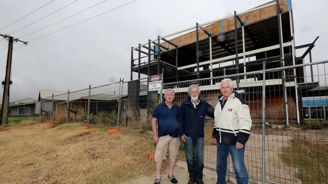 Carrickalinga Ratepayers Association members John Lawrence, David Catherwood and Chris Mather outside the controversial property at 9 Gold Coast Drive, Carrickalinga. Picture: Picture: Dylan Coker