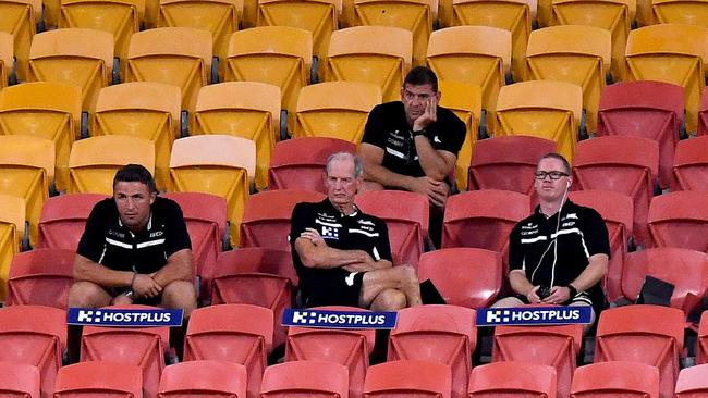 South Sydney coach Wayne Bennett (centre) sits with his coaching staff, including Sam Burgess (left). Picture: Getty Images