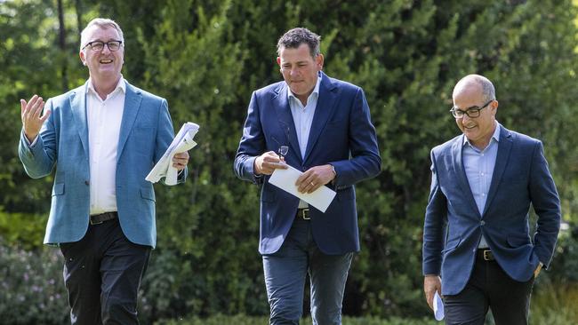 Premier Daniel Andrews with outgoing ministers Martin Foley and James Merlino. Picture: Aaron Francis