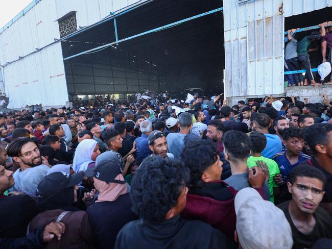 Four people were killed in the chaos at the food warehouse. Picture: AFP