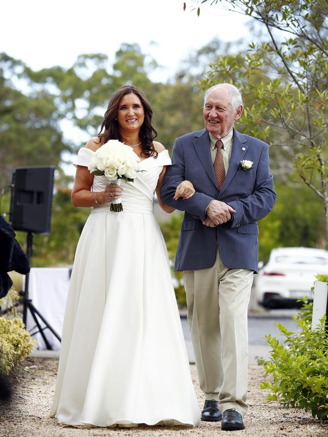 Baird is walked to the alter by her father David. Picture: Sam Ruttyn