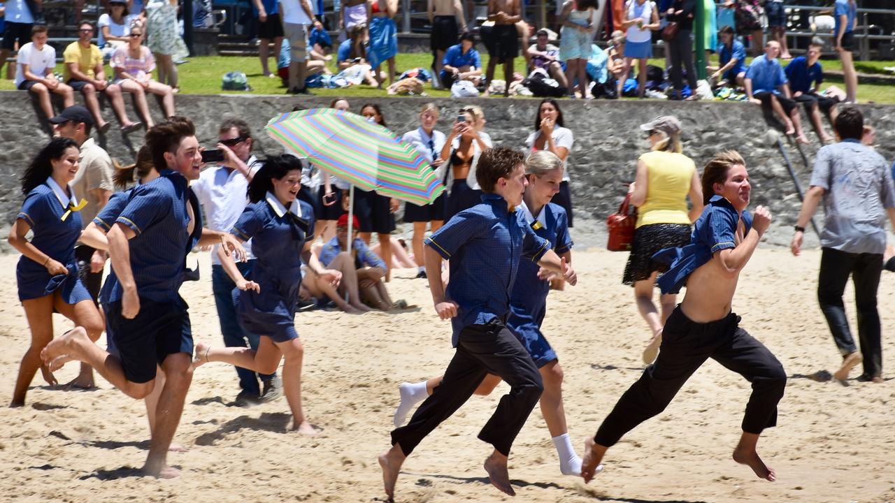 Year 12 graduates from schools across the Sunshine Coast hit to the water at Mooloolaba Beach to celebrate the end of their schooling. Photo: Mark Furler