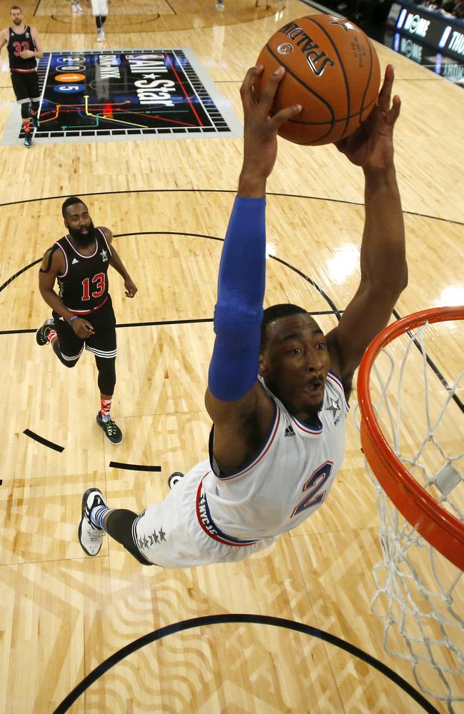 Eastern Conference’s John Wall dunks the ball during the first half.