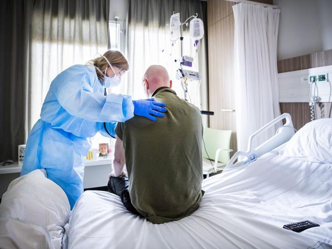 A doctor listens to the breathing of a COVID-19 patient who is recovering in an intensive care unit in the Netherlands. Picture: AFP