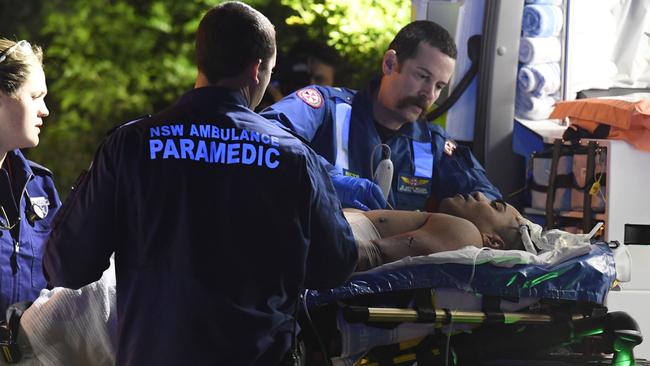 Hunuki Williams is wheeled to a waiting ambulance early on Saturday morning. Picture: Gordon McComiskie