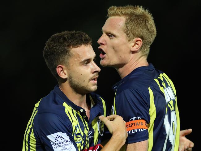 GOSFORD, AUSTRALIA - FEBRUARY 22: Matt Simon of the Central Coast Mariners is restrained by team mate Jordan Murray after getting sent off during the Round 20 A-League Match between the Central Coast Mariners and Brisbane Roar FC at Central Coast Stadium on February 22, 2019 in Gosford, Australia. (Photo by Tony Feder/Getty Images)