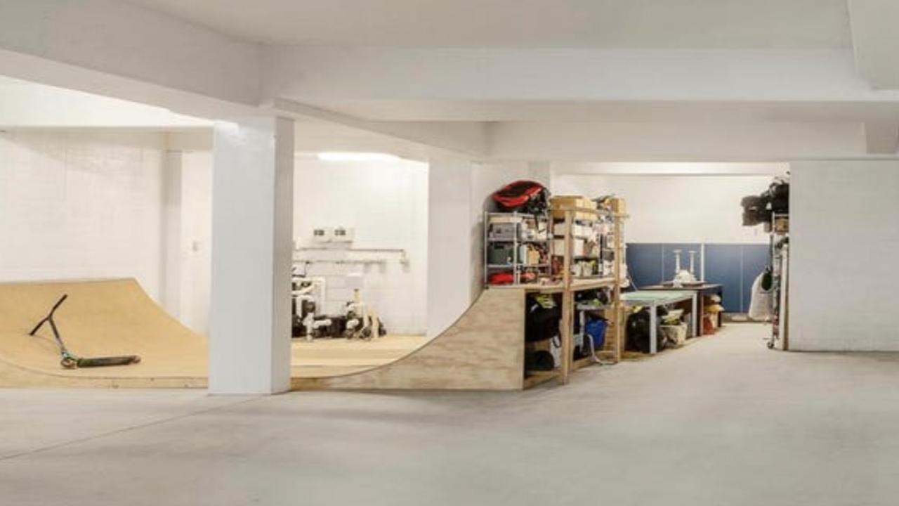 Beneath the floors of this Kew mansion lies a full-sized indoor skate ramp added by the previous owner as part of a bold basement fit-out.