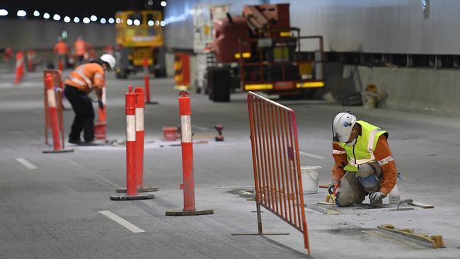 Workers in one of the M4 East tunnels. Picture: Dylan Coker