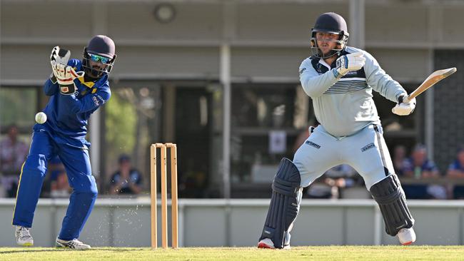 Deer Park wicketkeeper Mohammed Alfar and St Frances de Sales bat Jared Keenan. Picture: Andy Brownbill