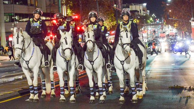 Mounted police officers watch a protest rally walk in the CBD earlier last month. Picture: Brenton Edwards