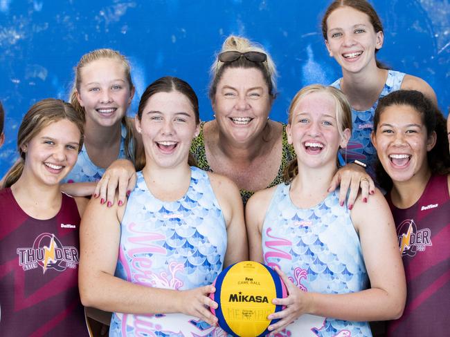 Mermaids Water polo club is the most successful junior club in Australia.  Sunday, March 17, 2019.  Coach of the Mermaids and assistant coach of the Qld thunder Nicola Johnson poses for a photograph in Yeronga with Kate Blew, Lara Owen, Louisa Downes,  Chelsea Johnson, Annabel Cowan, Josephine Crimmins, Matilda Elliott and Kasey Dalziel. (AAP Image/Renae Droop)