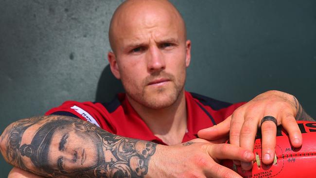 Melbourne captain Nathan Jones shows a tattoo of his forearm of his grandfather, who died of motor-neurone disease in 2015. Picture: Getty Images