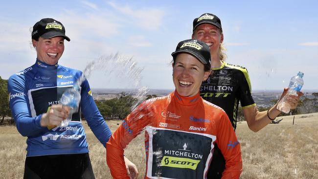 Amanda Spratt cools down in the Ochre jersey with team mates Saray Roy, left, and Lucy Kennedy. Picture Sarah Reed