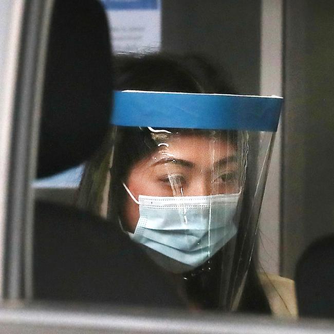 Sarah Caisip in full personal protective equipment to view her father’s body on Thursday. Picture: Annette Dew