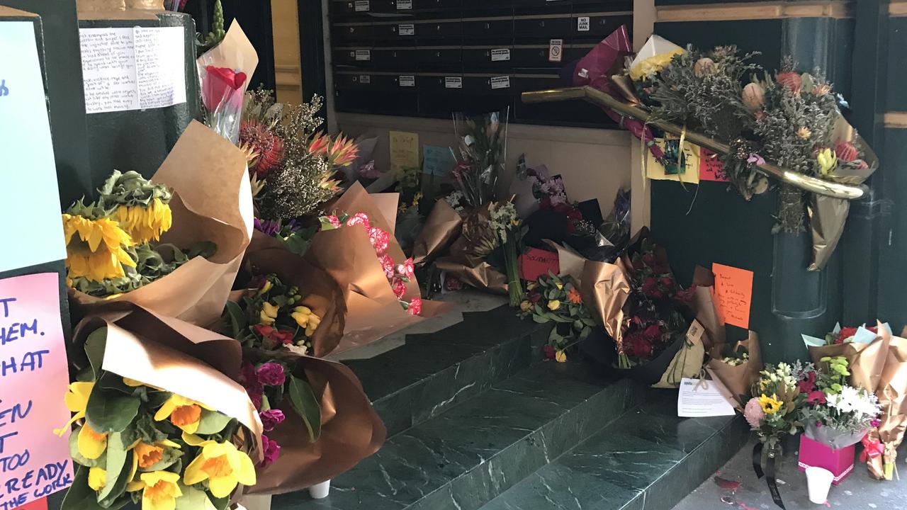 Flowers and handwritten notes left at the scene of Michaela Dunn’s murder on Clarence Street, Sydney. Dunn, 24, was murdered by Mert Ney on Tuesday afternoon, August 13, 2019.