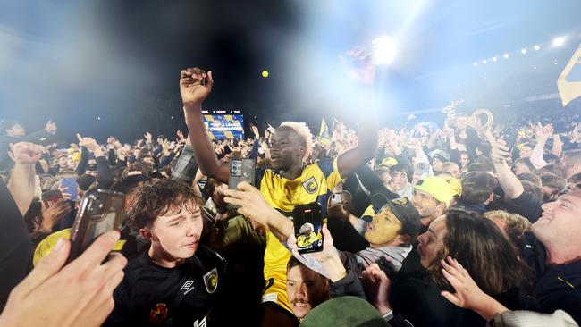 Alou Kuol celebrates with fans. Photo by Mark Metcalfe/Getty Images