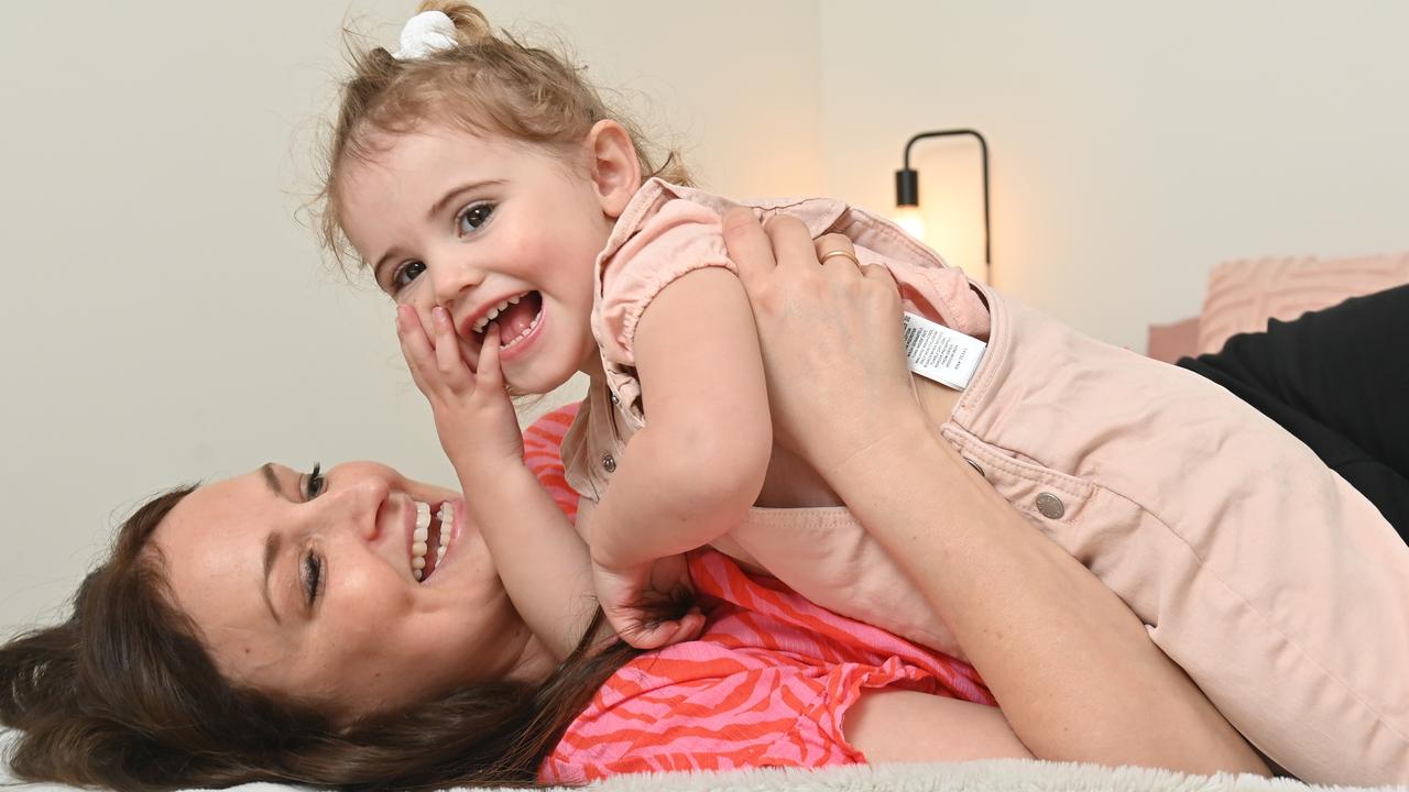 Natalie playing with Lottie. Picture: Keryn Stevens