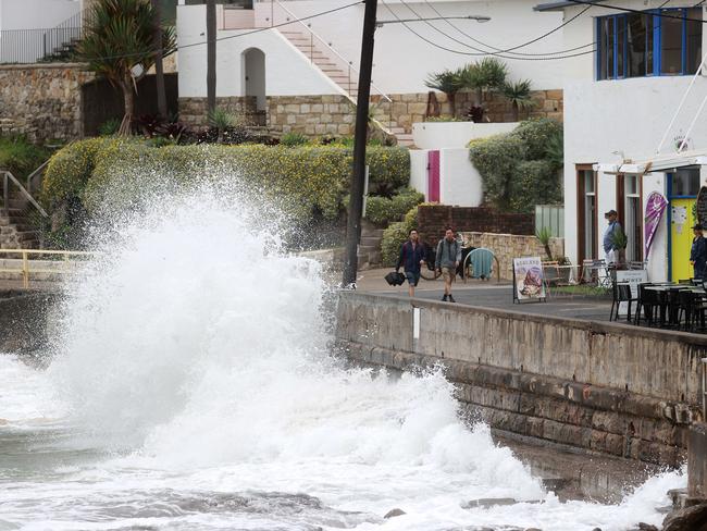 Splashdown for pedestrians and cafe-goers on the Manly to Shelly Beach walk. Picture: Tim Hunter