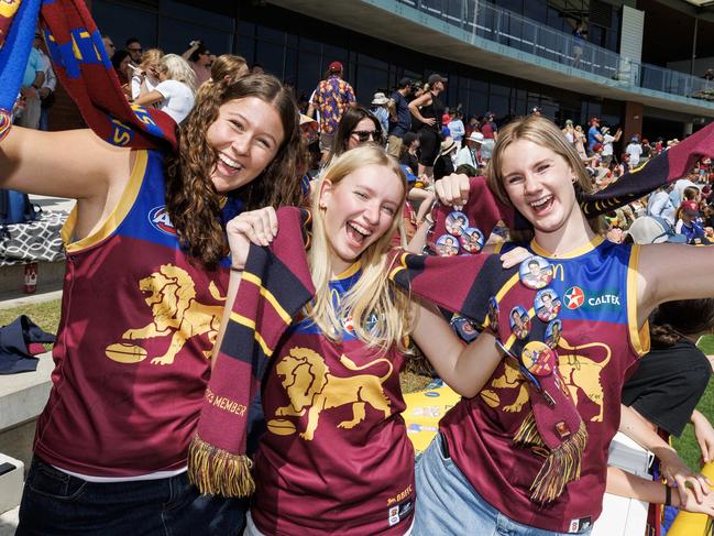 Lions Fans Taylor Fletcher 15, Sinead Slape 15, and Sara Murray 16 at Brighton Homes Arena to watch the Lions final training before heading to Melbourne for the Grand Final against the Sydney Swans. Picture Lachie Millard