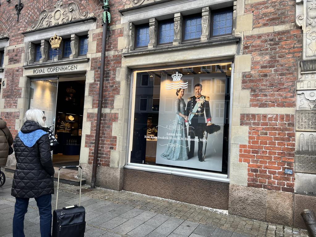 Posters of the royals grace the window display of the Royal Copenhagen China factory. Picture: Danielle Gusmaroli