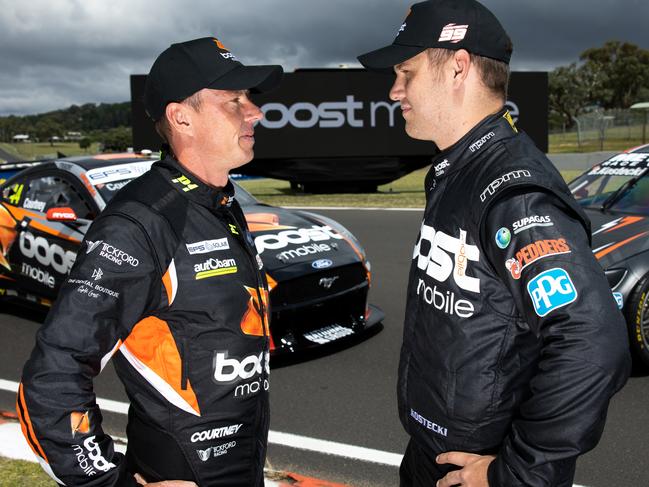 BATHURST, AUSTRALIA - FEBRUARY 25: (L-R) James Courtney driver of the #44 Boost Mobile Racing Ford Mustang and Brodie Kostecki driver of the #99 Erebus Motorsport Holden Commodore ZB pose ahead of the Mount Panorama 500 which is part of the 2021 Supercars Season at Mount Panorama on February 25, 2021 in Bathurst, Australia. (Photo by Daniel Kalisz/Getty Images)