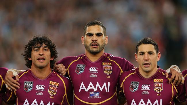 Greg Inglis (centre) made his Queensland debut at 19 and went on to captain the Maroons.