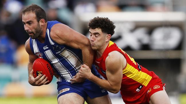 Sam Flanders tackles Ben Cunnington during the match at Blundstone Arena. Picture: Getty