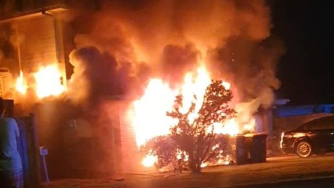 Sydney mother Montana Adams' two-storey house in Macquarie Fields was destroyed last May but her life and the lives of eight other occupants were saved when their smoke alarms sounded. Picture: Fire and Rescue NSW