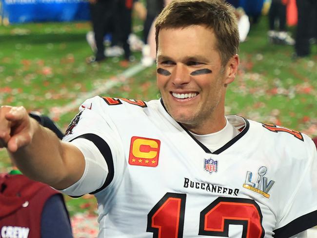 (FILES) In this file photo taken on February 07, 2021, Tom Brady of the Tampa Bay Buccaneers celebrates after defeating the Kansas City Chiefs in Super Bowl LV at Raymond James Stadium in Tampa, Florida. - Brady has agreed to a contract extension with the Tampa Bay Buccaneers that will enable the Super Bowl champions to keep other top players, according to multiple reports on March 12, 2021. (Photo by Mike Ehrmann / GETTY IMAGES NORTH AMERICA / AFP)