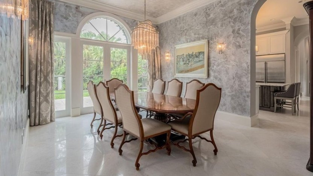 The property is the epitome of elegance thanks to its two-storey, coffered ceilings; crown moulding; marble flooring; and Venetian plaster. Picture: Supplied