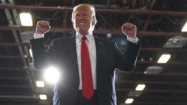 Putting on a winning face, President Donald Trump reacts to a cheering audience as he leaves a rally at the Four Seasons Arena in Montana last Thursday.