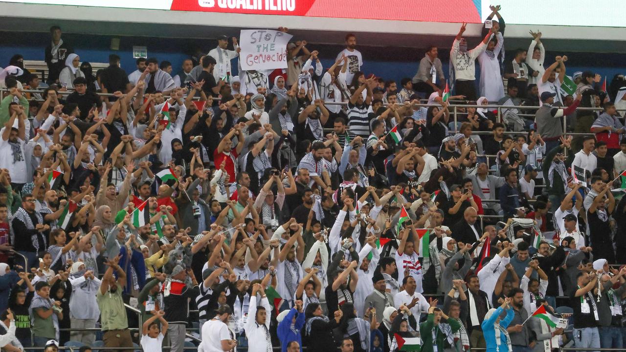 Palestinian fans in full voice. Picture: Yasser Al-Zayyat / AFP