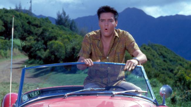 Elvis and his red MG in a still from Blue Hawaii (1961). © EPE. Graceland and its marks are trademarks of EPE. All Rights Reserved. Elvis Presley™ © 2021 ABG EPE IP LLC. Elvis: Direct from Graceland brings some of the King of Rock 'n' Roll's most prized possessions from Graceland to the Bendigo Art Gallery. Picture - Supplied, PLEASE NOTE WHEN PUBLISHING THIS IMAGE PLEASE INCLUDE IN THE CAPTION - , , © EPE. Graceland and its marks are trademarks of EPE. All Rights Reserved. Elvis Presley™ © 2021 ABG EPE IP LLC