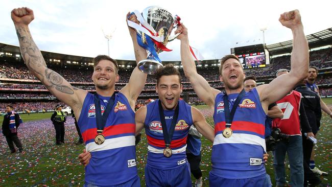 Clay Smith, Luke Dahlhaus and Matthew Boyd celebrate with the cup. Picture: Michel Klein