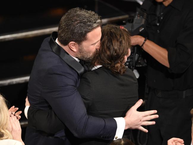 Ben Affleck, left, congratulates Casey Affleck as he accepts the award for best actor in a leading role for "Manchester by the Sea" at the Oscars. Picture: AP