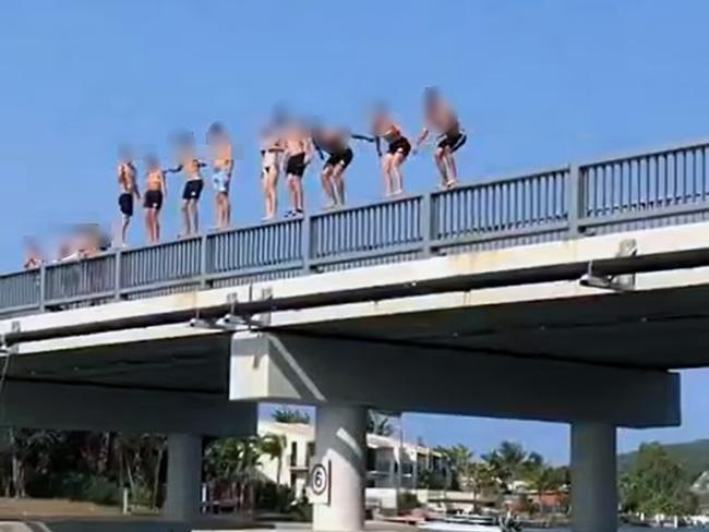 Facebook image of people jumpling off bridge.