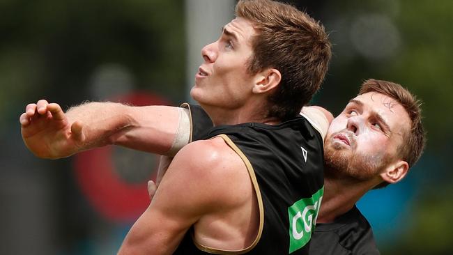 Mason Cox and Jordan Roughead battle at Collingwood training.