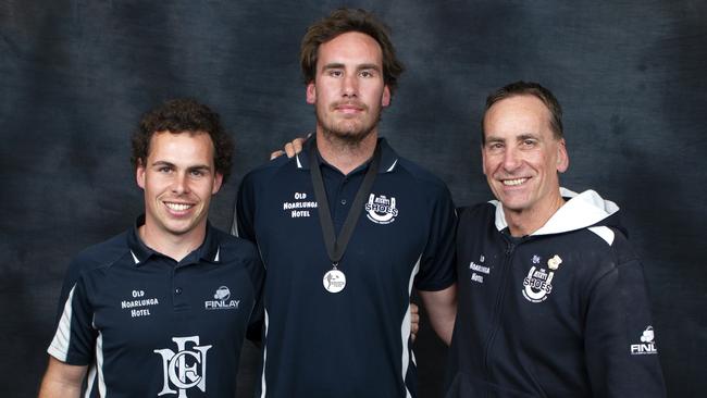 Noarlunga forward Nick Mott with brother Tom (left) and dad Jerry (right) after winning the 2018 Southern Football League’s Mail Medal. Picture: James Baker