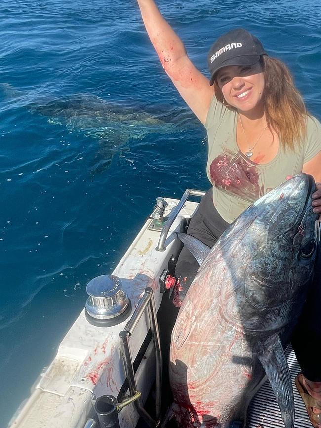 Izzy Sesto caught her first tuna of the coast of Cape Jaffa, only to have a great white shark take a huge bite out of it just as she landed it. Picture: @isabella.sesto/ Instagram