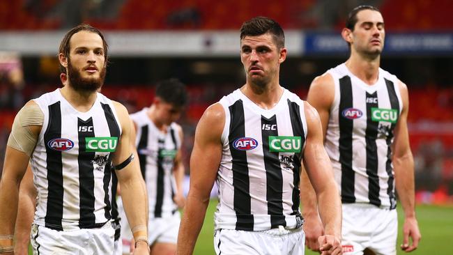 Scott Pendlebury, James Aish and Brodie Grundy leave the field after the loss to GWS. Picture: Getty