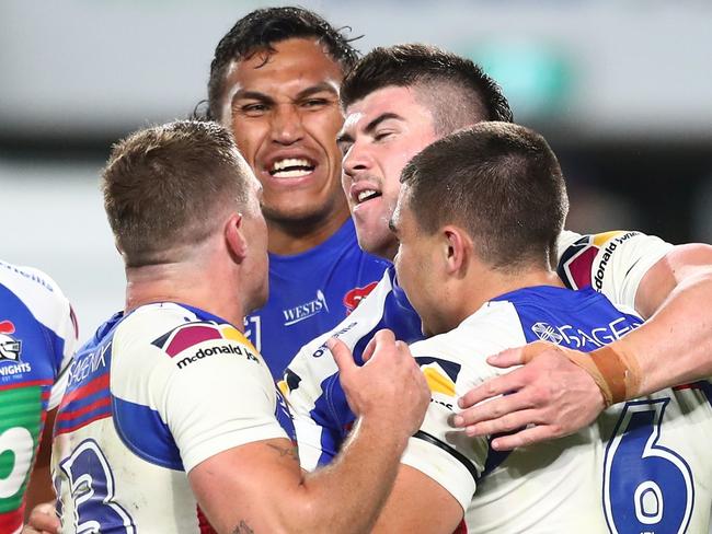 GOLD COAST, AUSTRALIA - AUGUST 21: Jake Clifford of the Knights celebrates scoring a try with team mates during the round 23 NRL match between the Canterbury Bulldogs and the Newcastle Knights at Cbus Super Stadium, on August 21, 2021, in Gold Coast, Australia. (Photo by Chris Hyde/Getty Images)