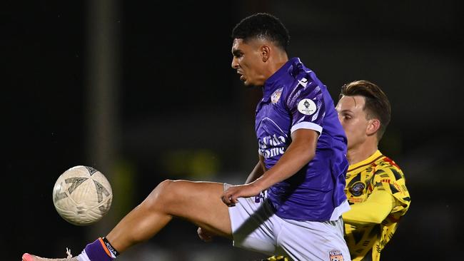 BRISBANE, AUSTRALIA - AUGUST 28: Abdelelah Faisal of Perth and Lachlan Sayers of Moreton City compete for the ball during the 2024 Australia Cup Round of 16 match between Moreton City Excelsior FC and Perth Glory FC at Perry Park on August 28, 2024 in Brisbane, Australia. (Photo by Albert Perez/Getty Images)