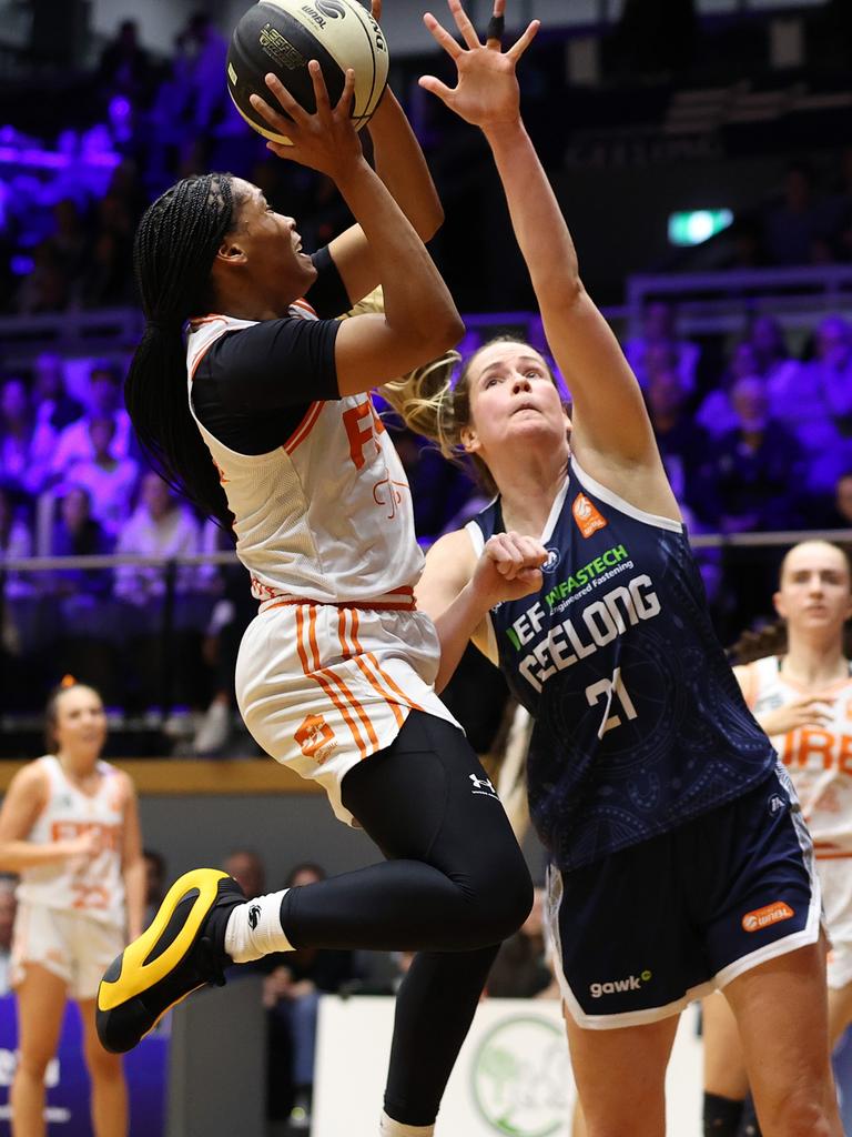 Townsville’s Zia Cooke drives to the basket against Keely Froling. Picture: Kelly Defina/Getty Images.