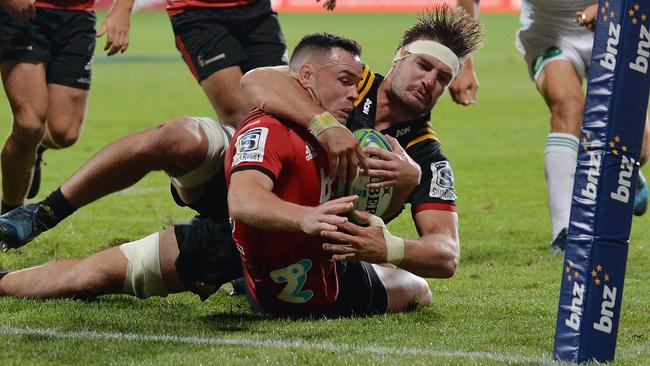 CHRISTCHURCH, NEW ZEALAND - FEBRUARY 24: Ryan Crotty of the Crusaders is tackled by Lachlan Boshier of the Chiefs during the round two Super Rugby match between the Crusaders and the Chiefs at AMI Stadium on February 24, 2018 in Christchurch, New Zealand.  (Photo by Kai Schwoerer/Getty Images)