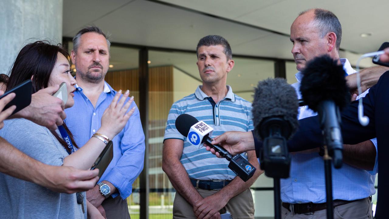 A resident confronts Julian Doyle, NSW Director of Icon Construction, during a press conference.