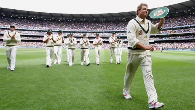 Shane Warne salutes the crowd after taking his 700th Test wicket in the fourth Ashes match between Australia and England at the Melbourne Cricket Ground on December 26, 2006. Picture: Getty Images