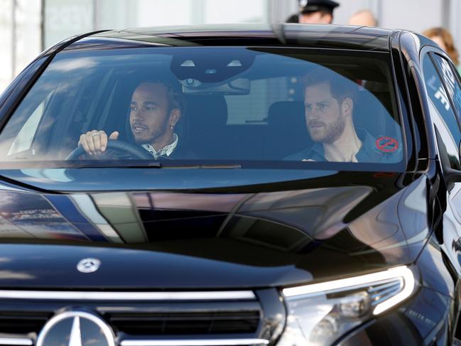 Lewis Hamilton drove Harry in a Mercedes, of course, to Silverstone Racetrack. Picture: AFP